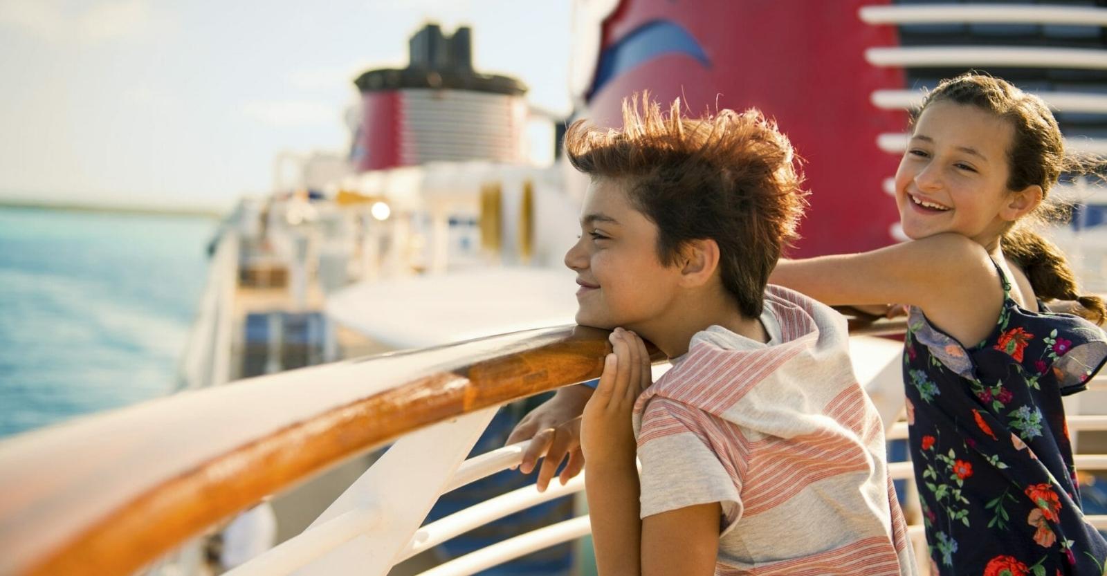 Children looking over the side of a cruise ship
