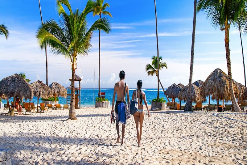 Couple walking along the beach in the Dominican Republic