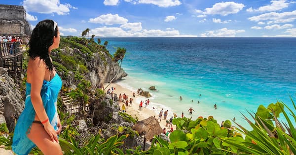 Woman looking over a cliff in Playa del Carmen