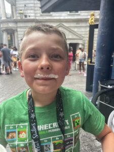 Boy with Butterbeer moustache Diagon Alley Wizarding World of Harry Potter Universal Studios Orlando