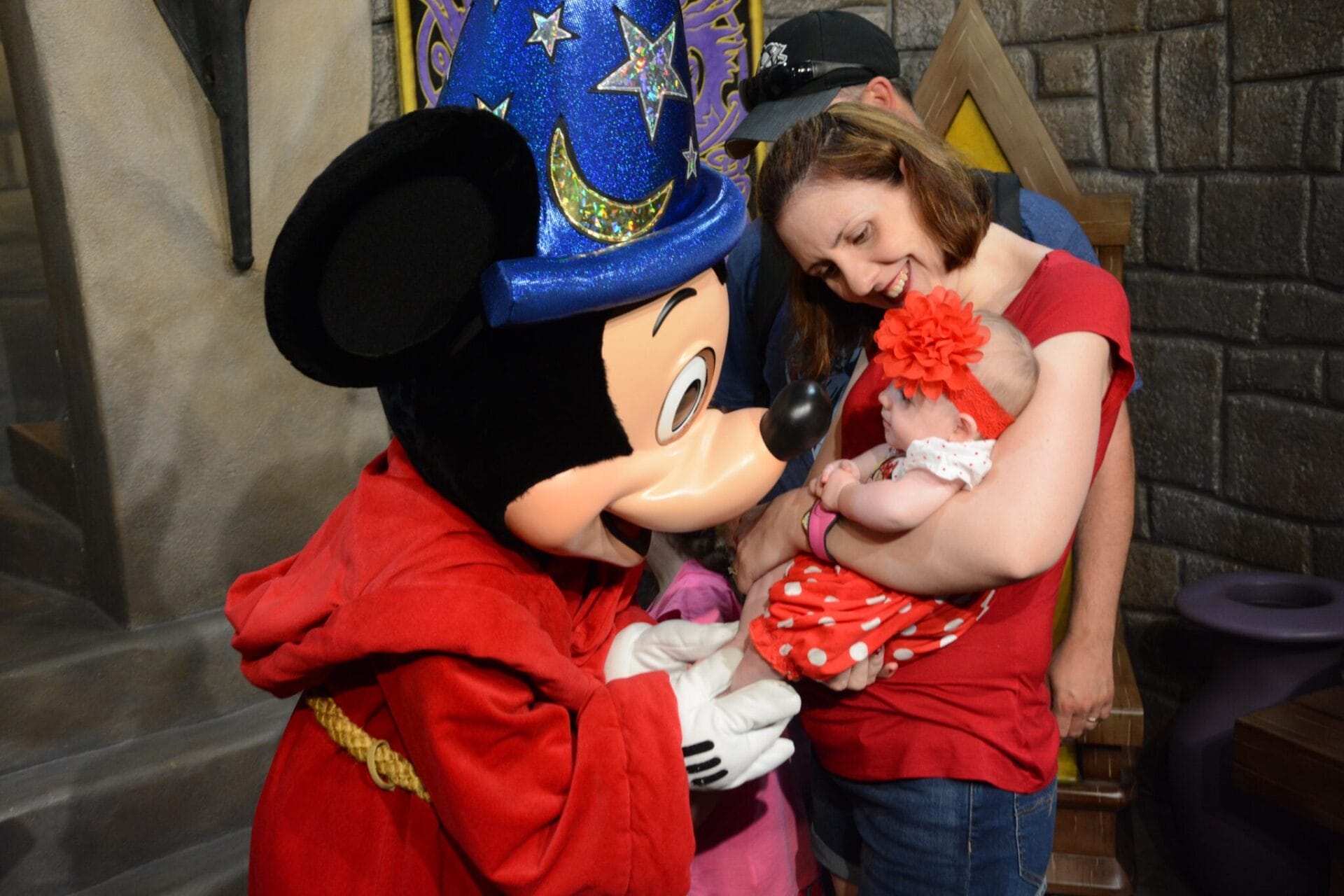 Baby meeting Mickey Mouse