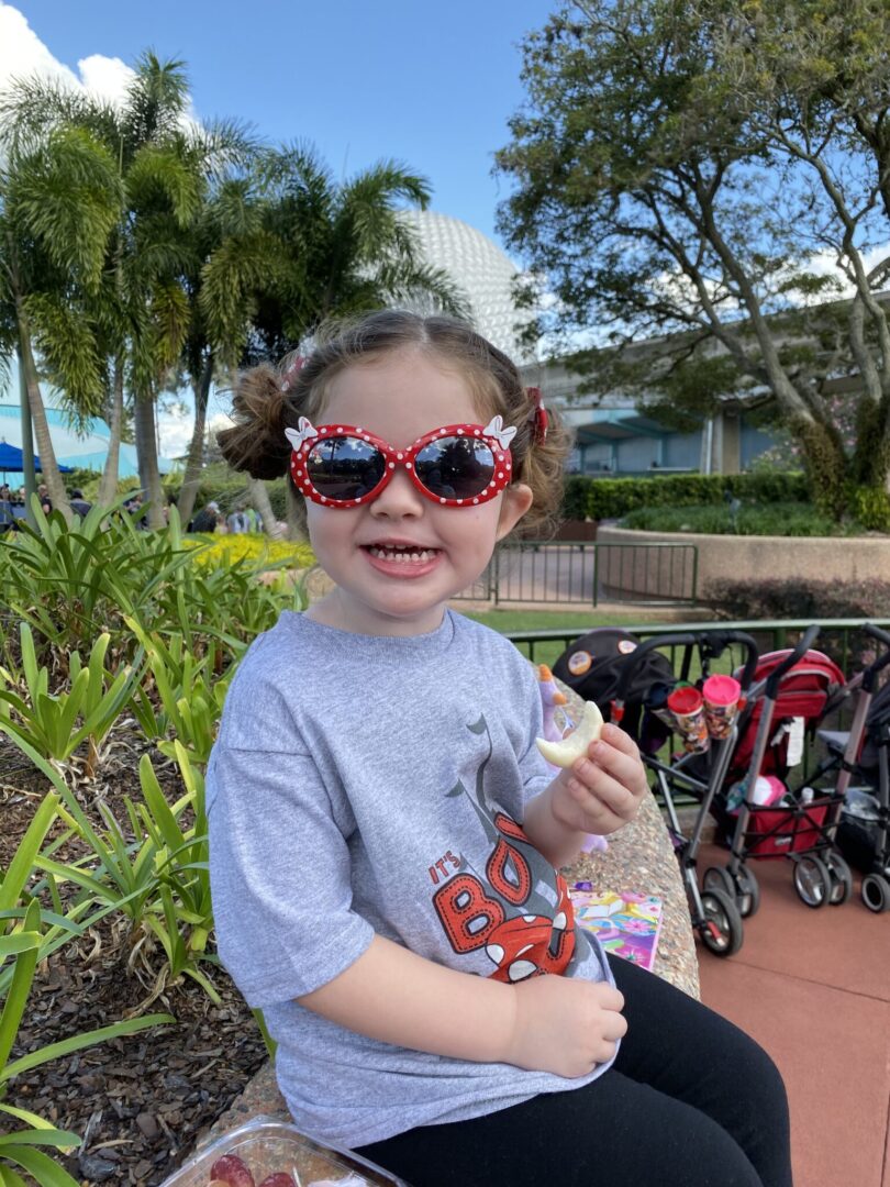 Toddler eating snack at EPCOT