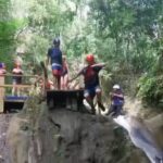 Waterfall jumping during a one day trip in Puerto Plata, Dominican Republic