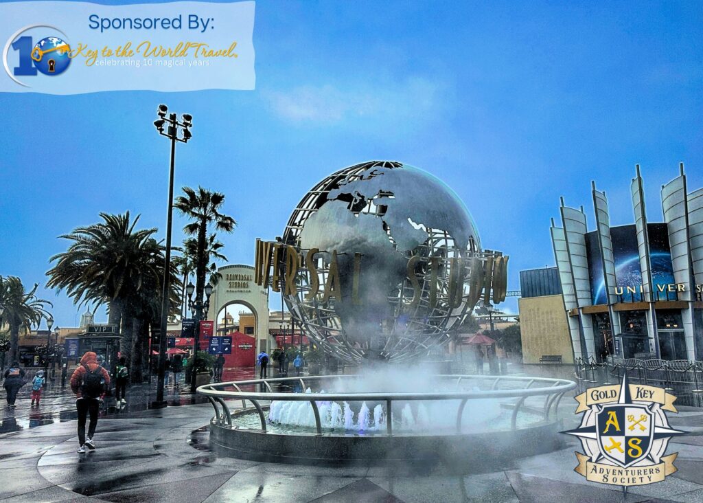 Universal Studios Hollywood entrance plaza, overlaid with logos for The Gold Key Adventurers Society Podcast and Key to the World Travel